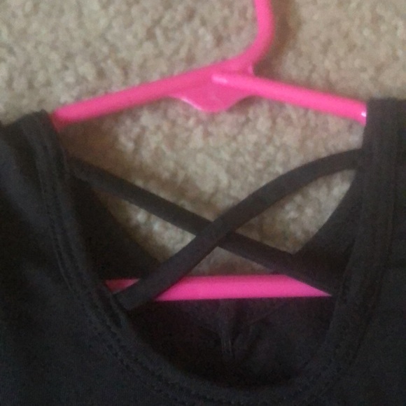 Is a 2T, golden bottom, black top, cross on back! - Picture 2 of 3